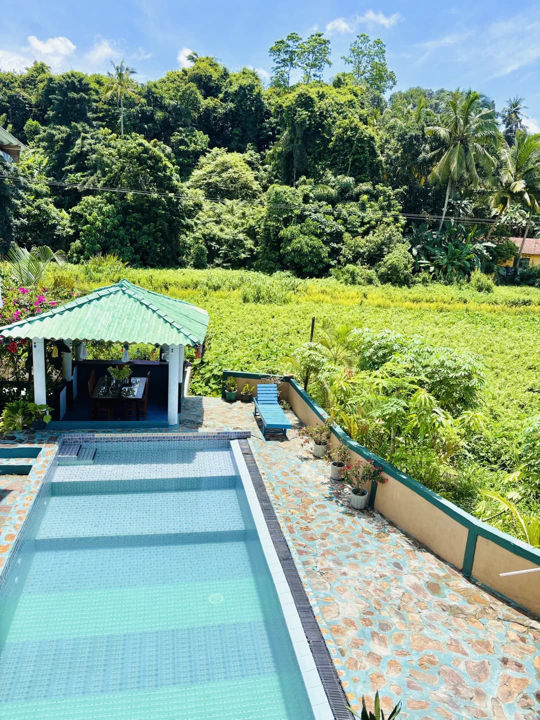 Poolside gazebo cabana bar with swimming pool at Anu Villa
