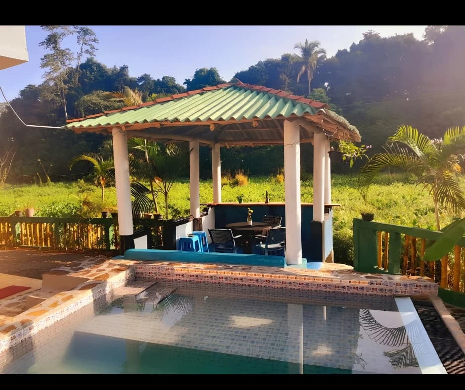 Poolside gazebo cabana bar with swimming pool at Anu Villa