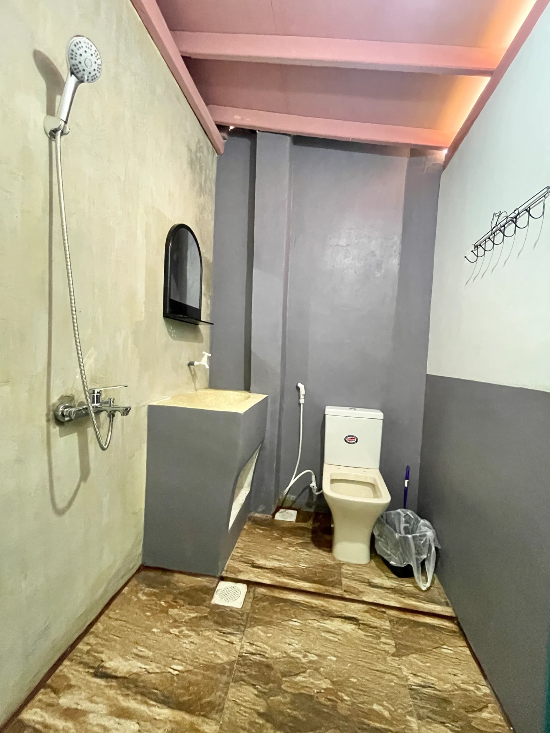 Clean modern bathroom with shower and vanity in Room 1